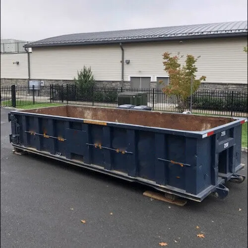 A 20 yard dumpster rental in a parking lot in Philadelphia County Pennsylvania